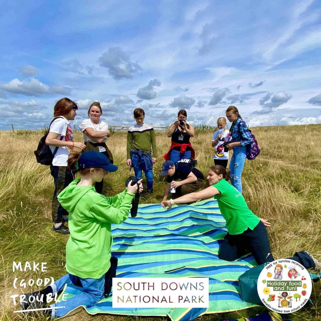Image of young people enjoying outdoor activity in the South Downs National Park with Make Good Trouble