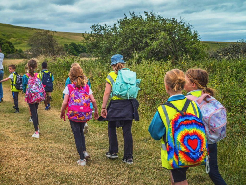 Children enjoying a school trip at Seven Sisters Country Park thanks to the Outdoor Travel Grant from South Downs Trust
