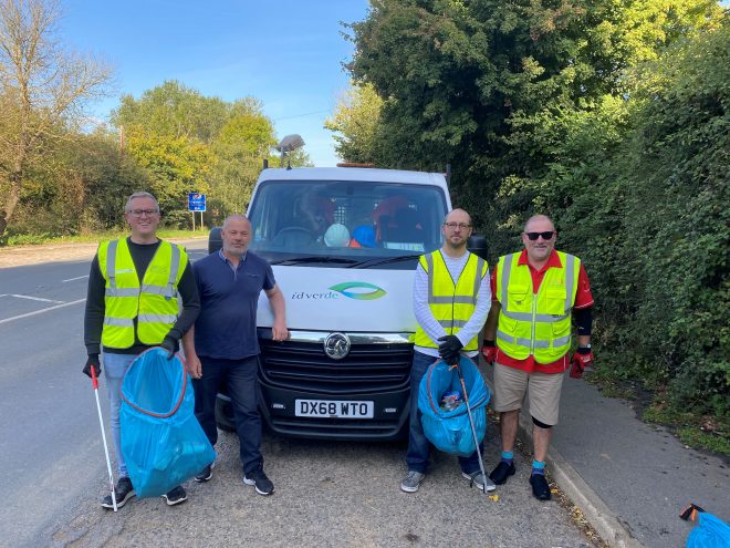 image shows litter pickers standing next to a contractors van from idverde